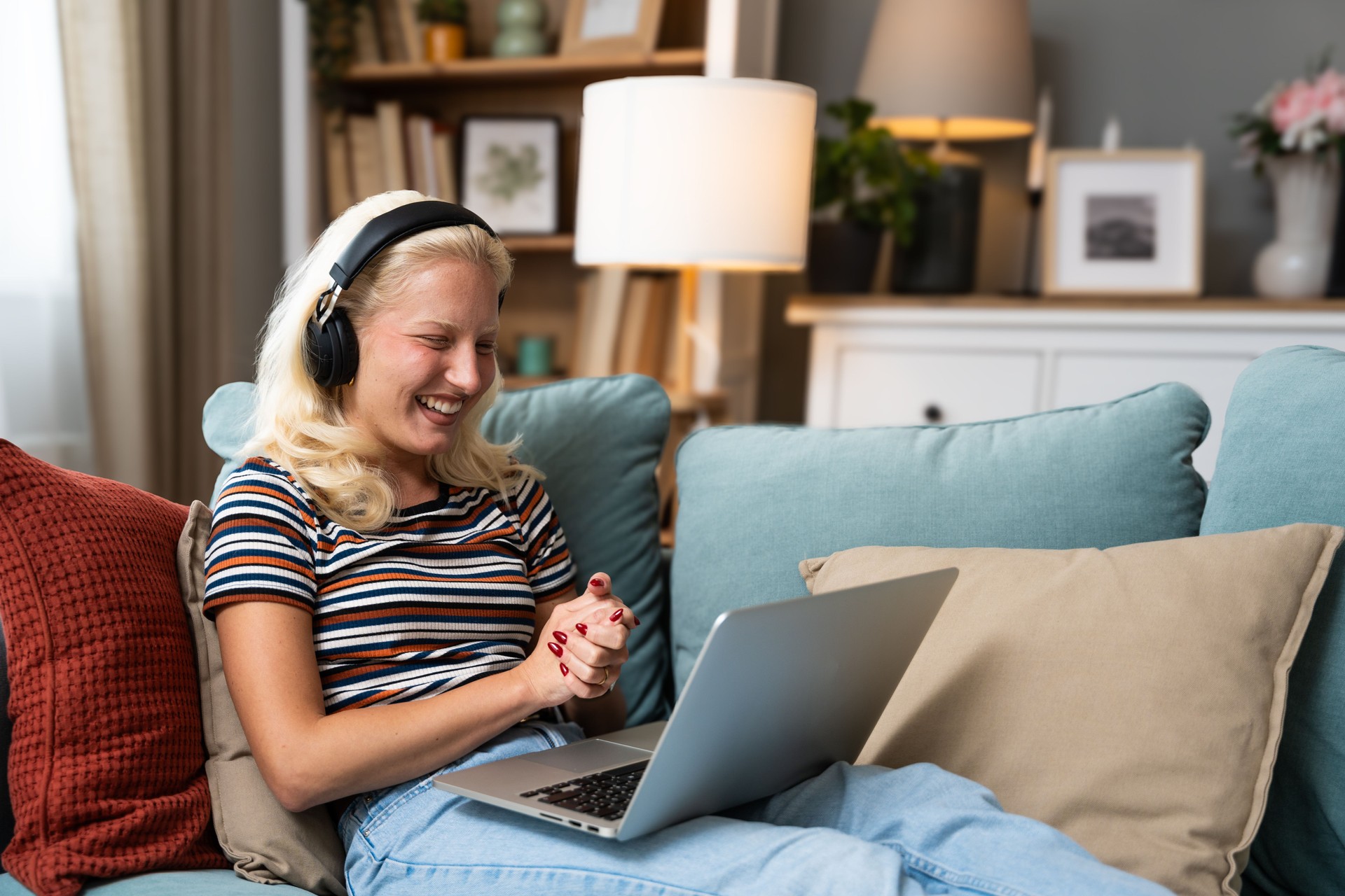 Young woman talking on video call with her psychotherapist doctor after online therapy sessions, happy that she is well and mentally health now after telemedicine conversations.