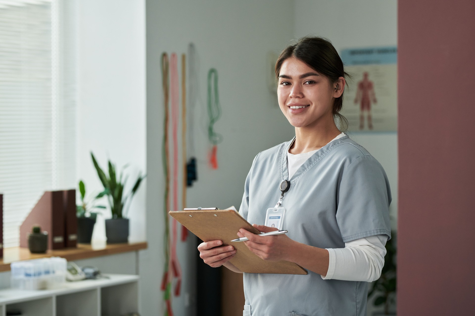 Smiling Nurse Standing in Modern Medical Facility